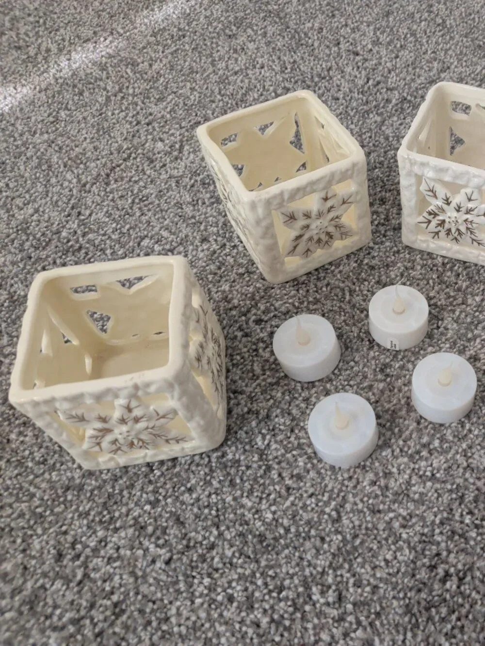 Set of 4 Cream Ceramic Pierced Poinsettia Tea Light Lanterns + 4 LED Candles